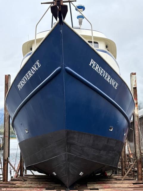 Fishing vessel on stands for damage assessment