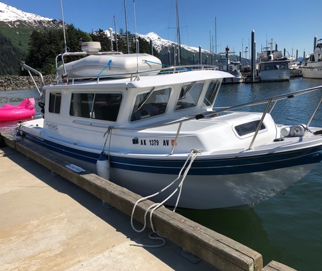 Cabin cruiser docked in Alaska marina