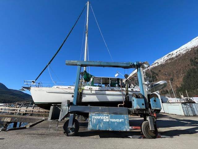 Sailboat lifted from water for hull inspection